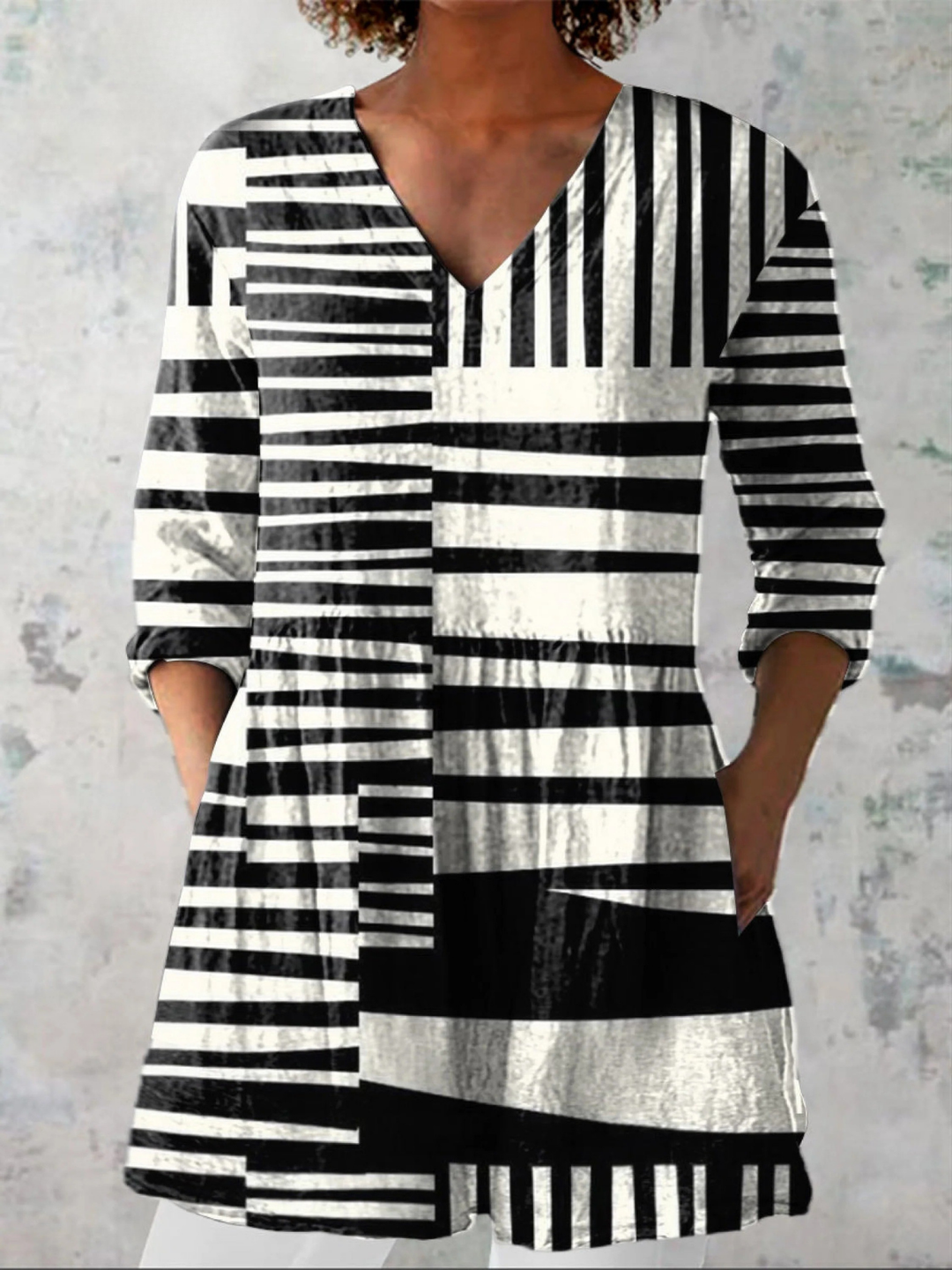 Blusa lunga fluida con scollo a V
