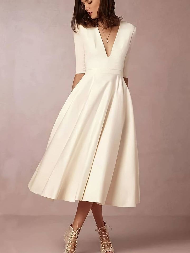 Vestidos midi acampanados para invitadas a bodas, listos para eventos formales