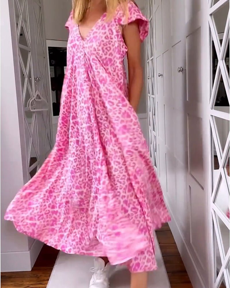 Elegancka sukienka w kwiaty z dekoltem w serek