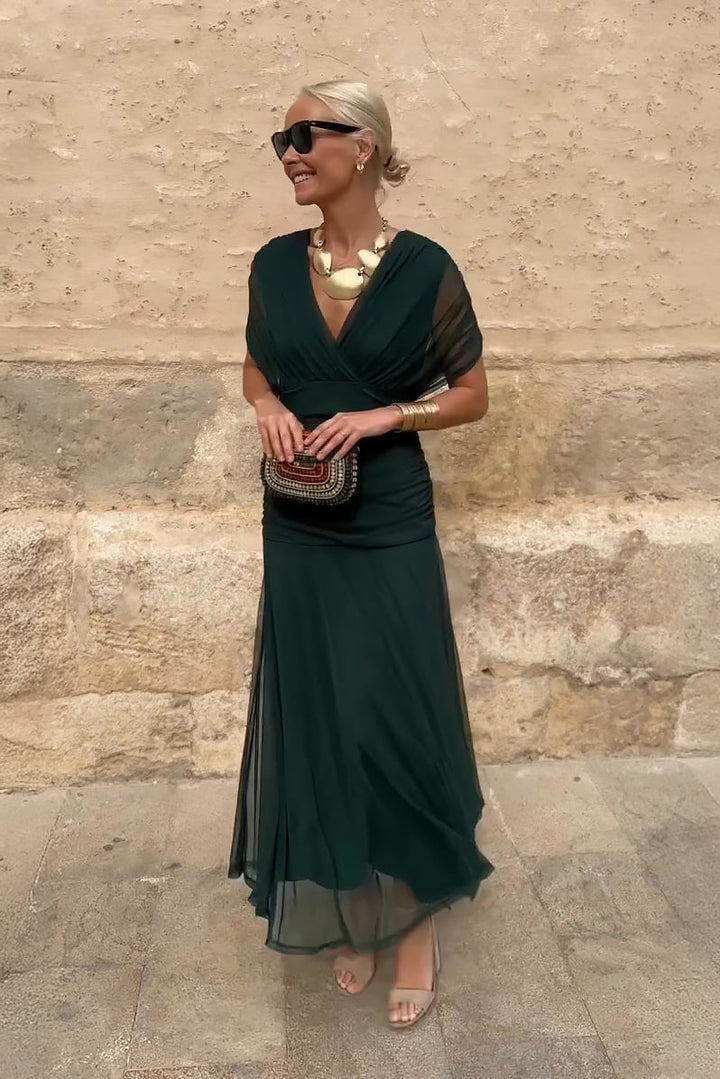 Elegancka długa sukienka na imprezę z dekoltem w serek