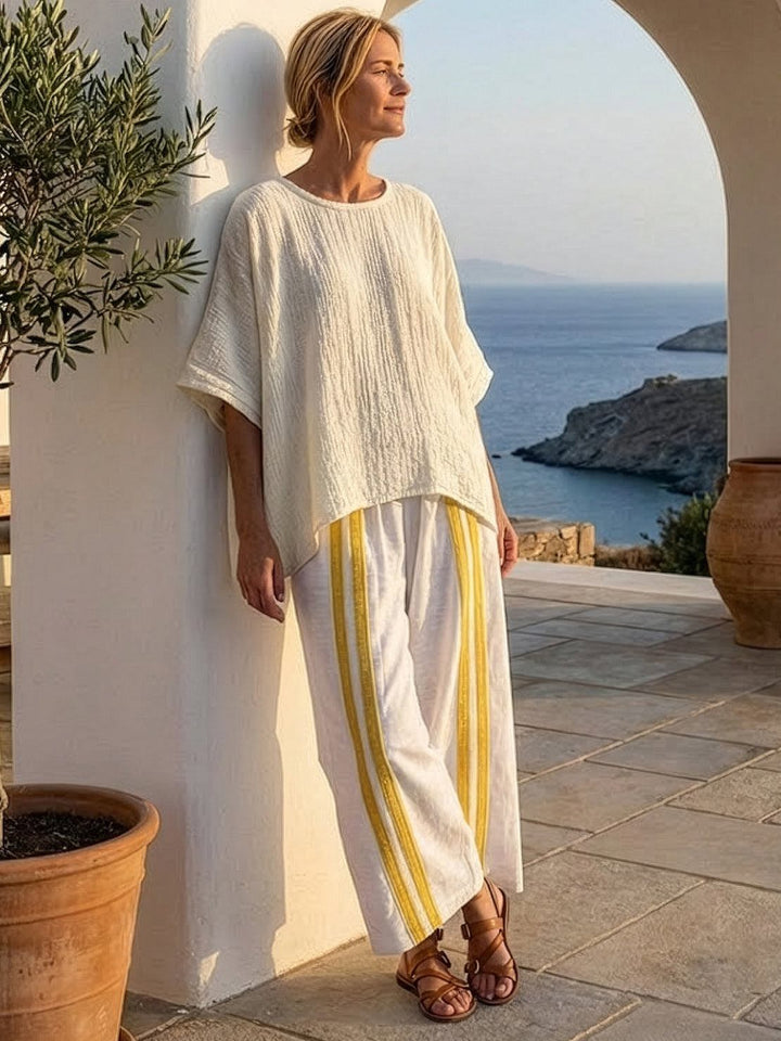 Conjunto de camiseta a rayas y pantalones de pierna ancha