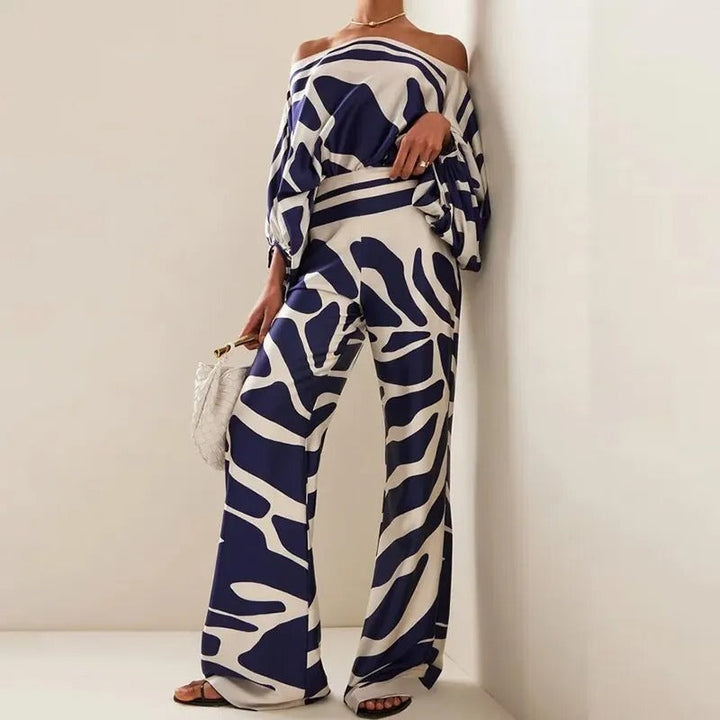 Completo pantaloni a gamba larga e spalle scoperte con stampa
