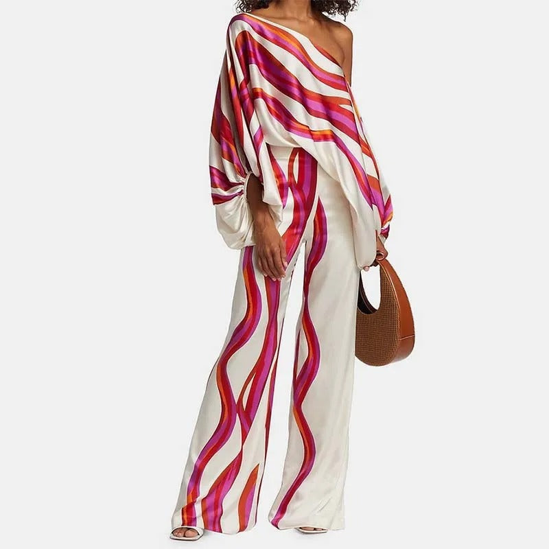 Completo pantaloni a gamba larga e spalle scoperte con stampa